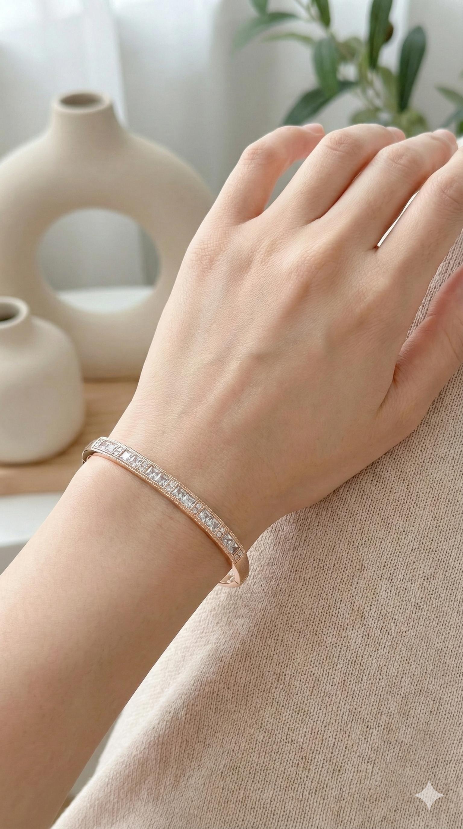 young woman wearing gold-plated hypoallergenic bracelet, showing their anti-tarnish shine suitable for sensitive skin and daily wear