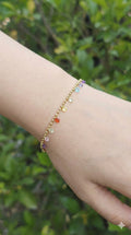 young woman wearing gold-plated hypoallergenic bracelet, showing their anti-tarnish shine suitable for sensitive skin and daily wear