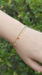 young woman wearing gold-plated hypoallergenic bracelet, showing their anti-tarnish shine suitable for sensitive skin and daily wear