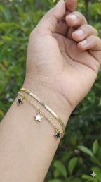 young woman wearing gold-plated hypoallergenic bracelet, showing their anti-tarnish shine suitable for sensitive skin and daily wear