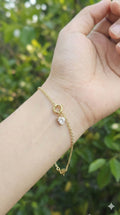 young woman wearing gold-plated hypoallergenic bracelet, showing their anti-tarnish shine suitable for sensitive skin and daily wear