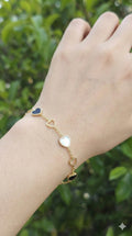 young woman wearing gold-plated hypoallergenic bracelet, showing their anti-tarnish shine suitable for sensitive skin and daily wear
