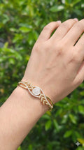 young woman wearing gold-plated hypoallergenic bracelet, showing their anti-tarnish shine suitable for sensitive skin and daily wear