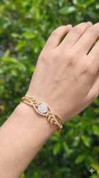 young woman wearing gold-plated hypoallergenic bracelet, showing their anti-tarnish shine suitable for sensitive skin and daily wear