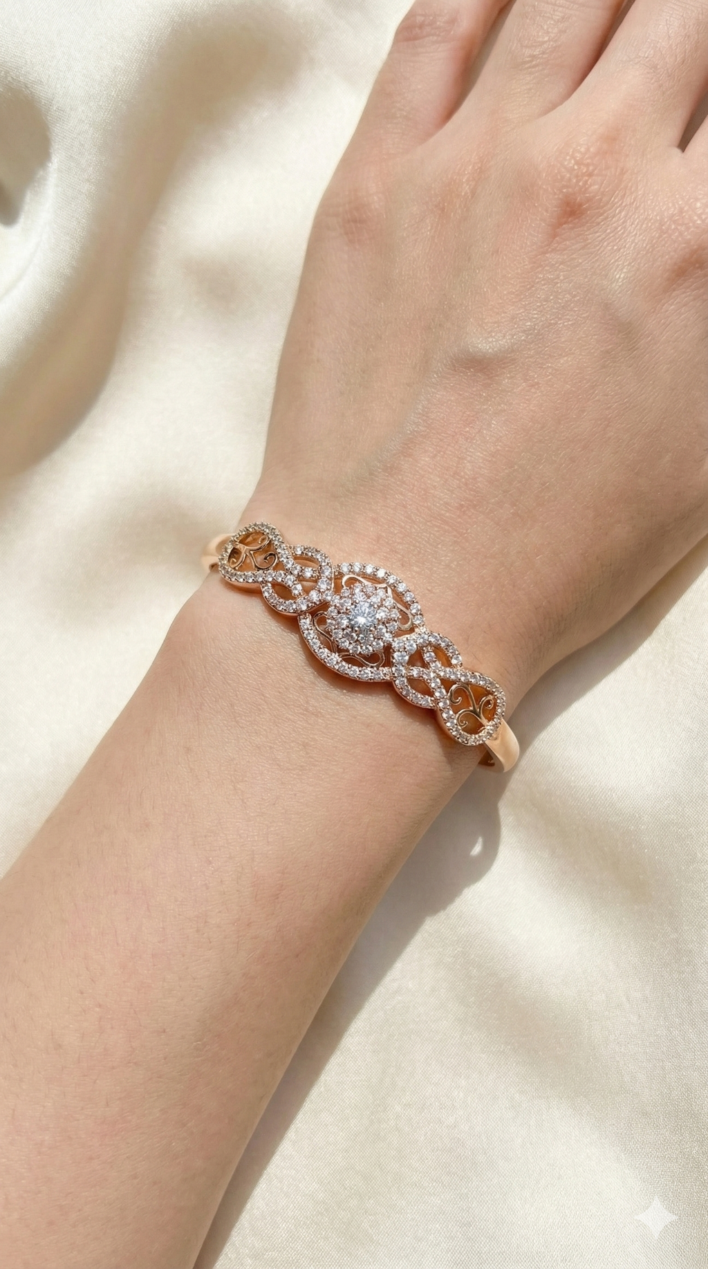 young woman wearing gold-plated hypoallergenic bracelet, showing their anti-tarnish shine suitable for sensitive skin and daily wear