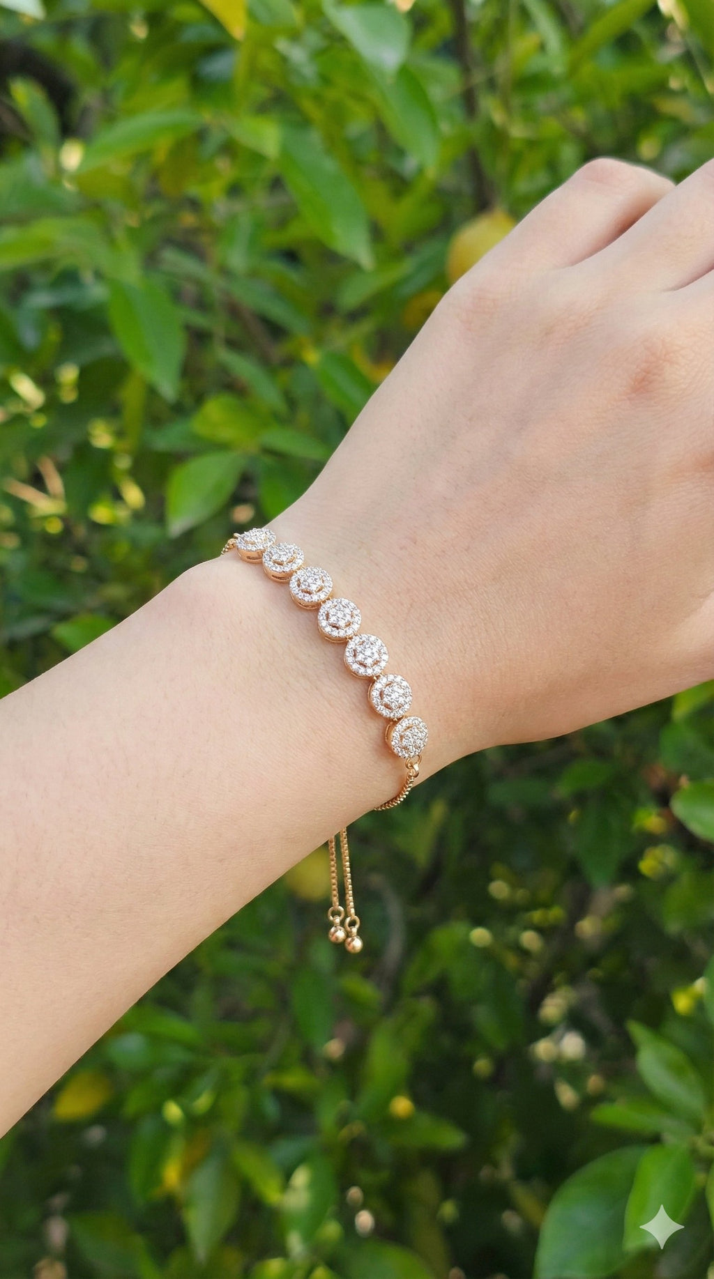 young woman wearing gold-plated hypoallergenic bracelet, showing their anti-tarnish shine suitable for sensitive skin and daily wear