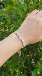 young woman wearing gold-plated hypoallergenic bracelet, showing their anti-tarnish shine suitable for sensitive skin and daily wear