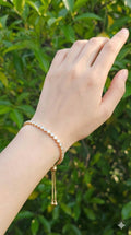 young woman wearing gold-plated hypoallergenic bracelet, showing their anti-tarnish shine suitable for sensitive skin and daily wear