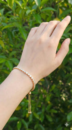 young woman wearing gold-plated hypoallergenic bracelet, showing their anti-tarnish shine suitable for sensitive skin and daily wear