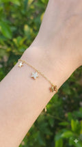 young woman wearing gold-plated hypoallergenic bracelet, showing their anti-tarnish shine suitable for sensitive skin and daily wear