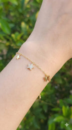 young woman wearing gold-plated hypoallergenic bracelet, showing their anti-tarnish shine suitable for sensitive skin and daily wear