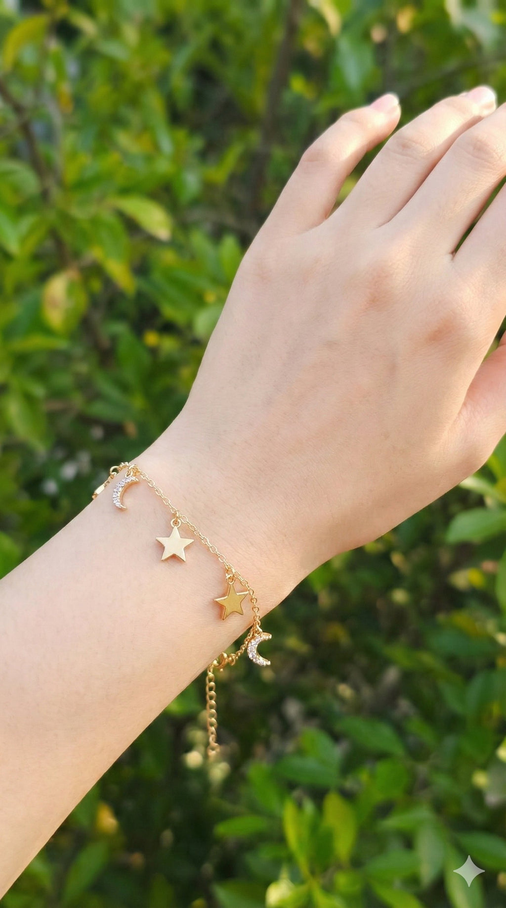 young woman wearing gold-plated hypoallergenic bracelet, showing their anti-tarnish shine suitable for sensitive skin and daily wear