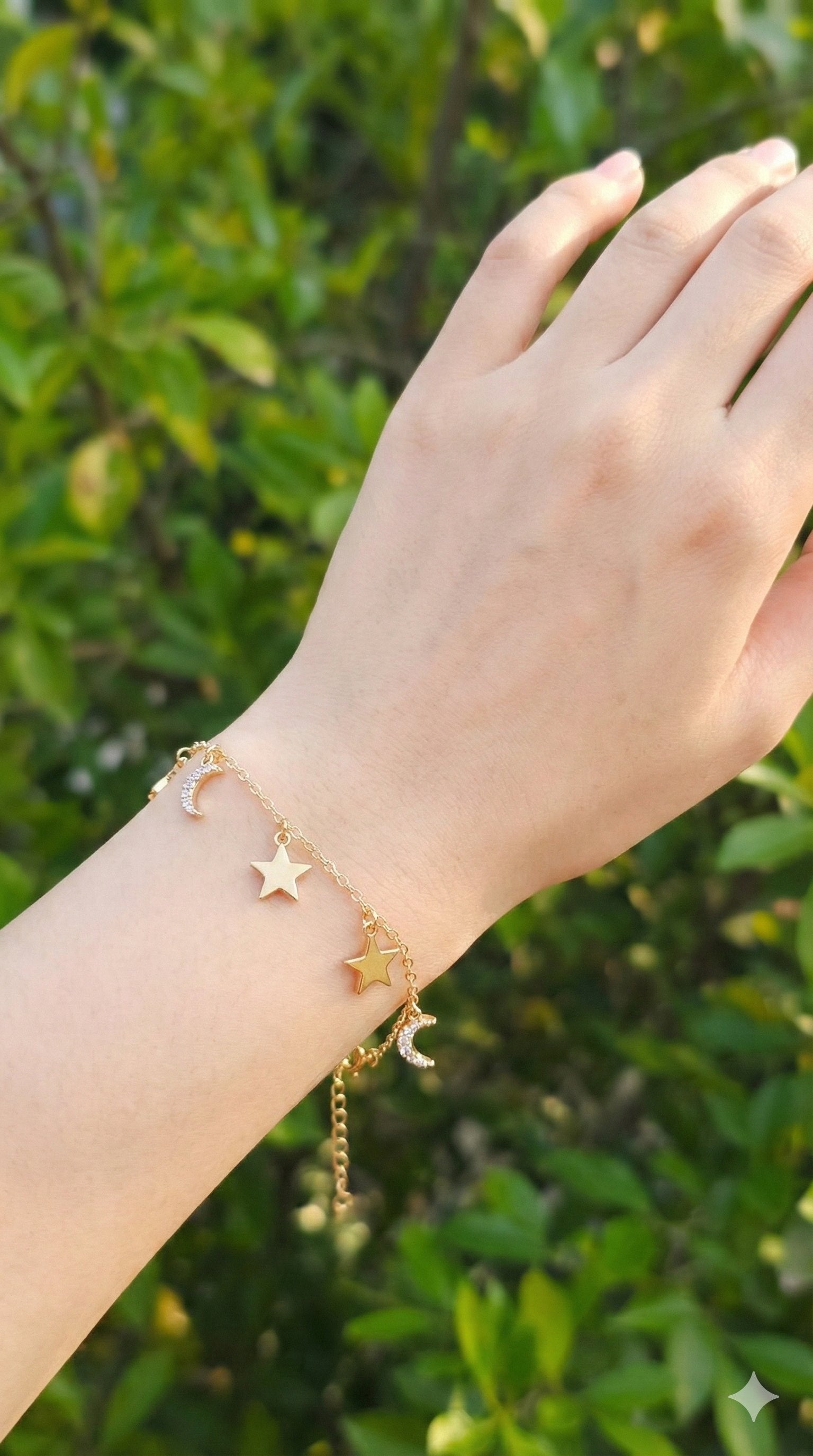 young woman wearing gold-plated hypoallergenic bracelet, showing their anti-tarnish shine suitable for sensitive skin and daily wear