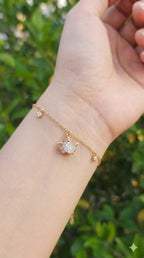 young woman wearing gold-plated hypoallergenic bracelet, showing their anti-tarnish shine suitable for sensitive skin and daily wear