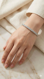 young woman wearing gold-plated hypoallergenic bracelet, showing their anti-tarnish shine suitable for sensitive skin and daily wear