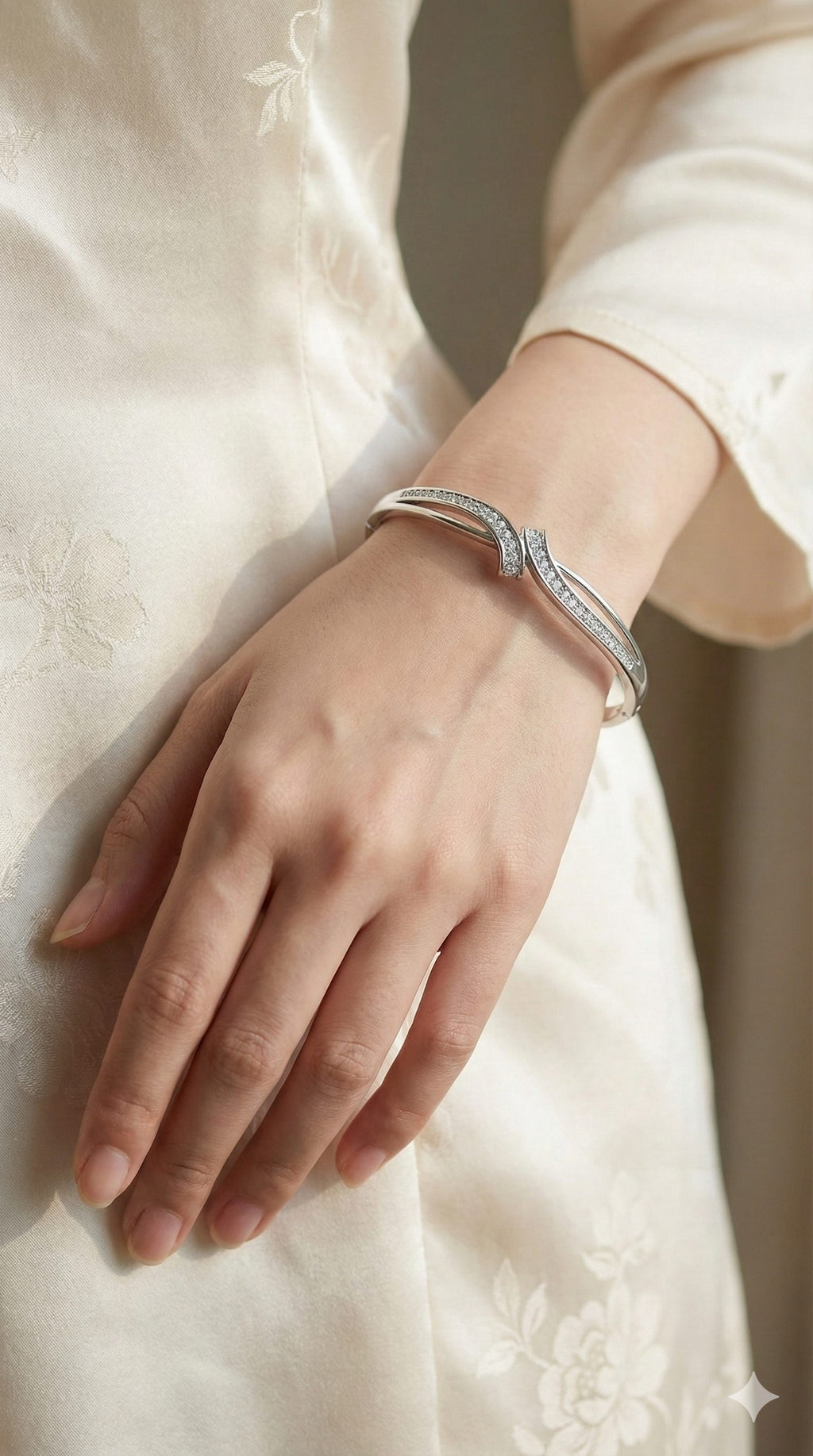 young woman wearing gold-plated hypoallergenic bracelet, showing their anti-tarnish shine suitable for sensitive skin and daily wear