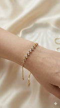 young woman wearing gold-plated hypoallergenic bracelet, showing their anti-tarnish shine suitable for sensitive skin and daily wear