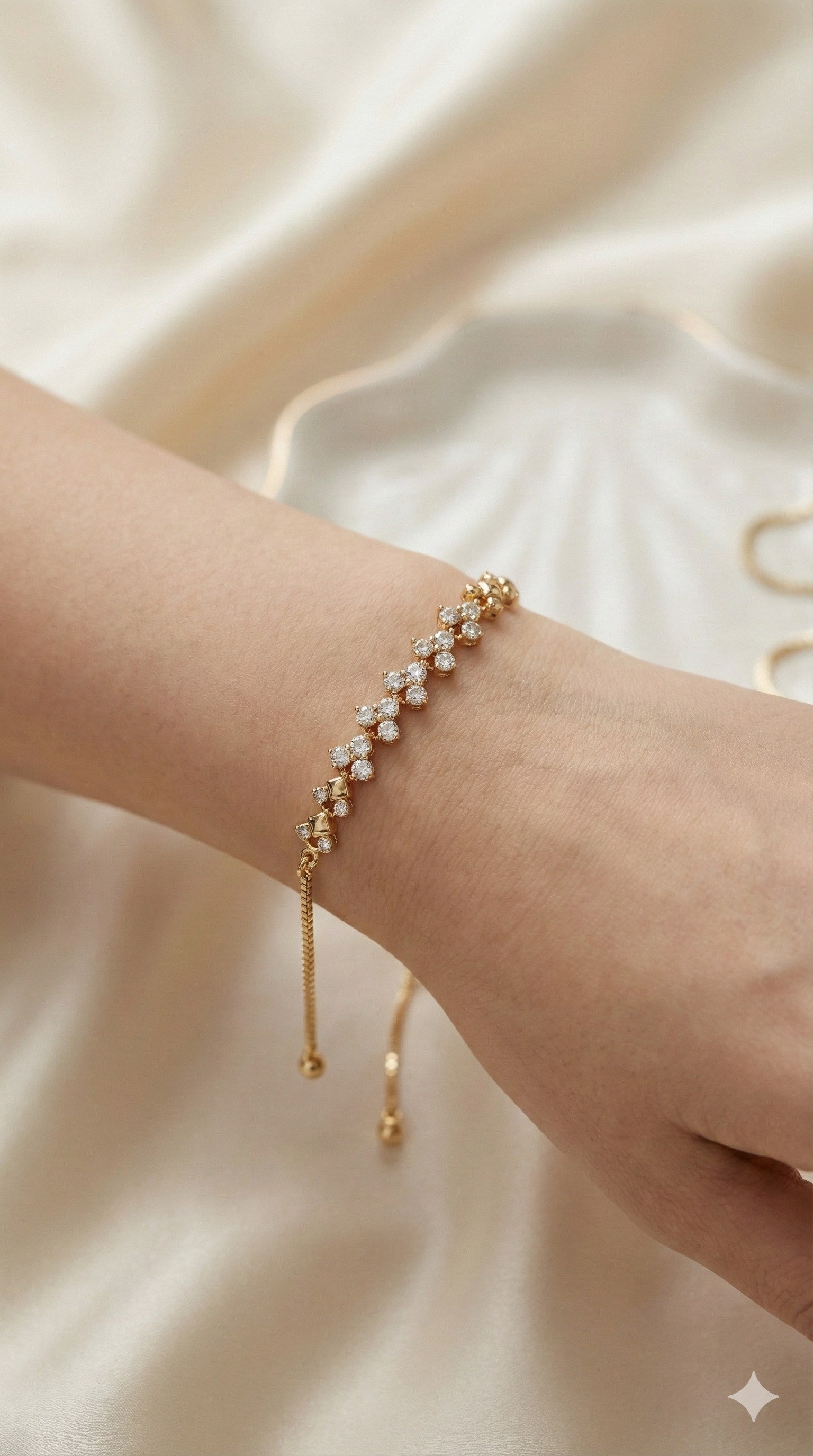young woman wearing gold-plated hypoallergenic bracelet, showing their anti-tarnish shine suitable for sensitive skin and daily wear