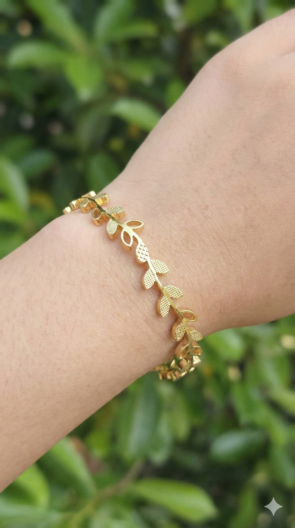 young woman wearing gold-plated hypoallergenic bracelet, showing their anti-tarnish shine suitable for sensitive skin and daily wear