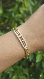 young woman wearing gold-plated hypoallergenic bracelet, showing their anti-tarnish shine suitable for sensitive skin and daily wear