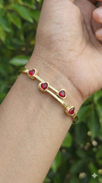 young woman wearing gold-plated hypoallergenic bracelet, showing their anti-tarnish shine suitable for sensitive skin and daily wear