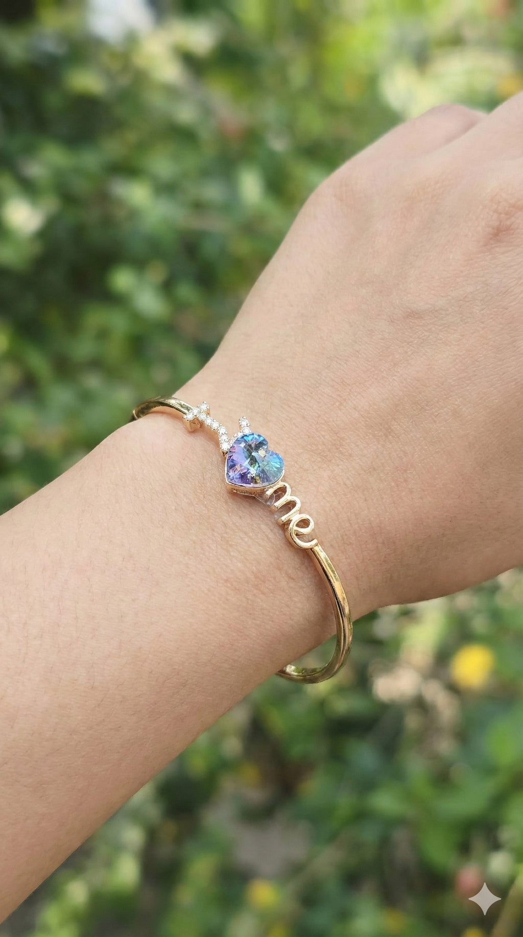 young woman wearing gold-plated hypoallergenic bracelet, showing their anti-tarnish shine suitable for sensitive skin and daily wear