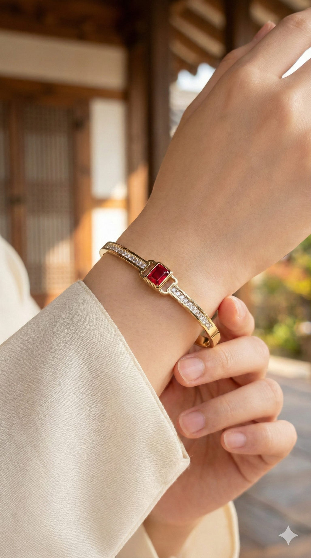 young woman wearing gold-plated hypoallergenic bracelet, showing their anti-tarnish shine suitable for sensitive skin and daily wear