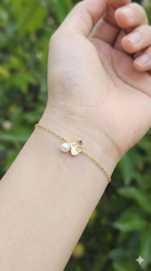 young woman wearing gold-plated hypoallergenic bracelet, showing their anti-tarnish shine suitable for sensitive skin and daily wear
