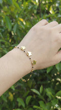 young woman wearing gold-plated hypoallergenic bracelet, showing their anti-tarnish shine suitable for sensitive skin and daily wear