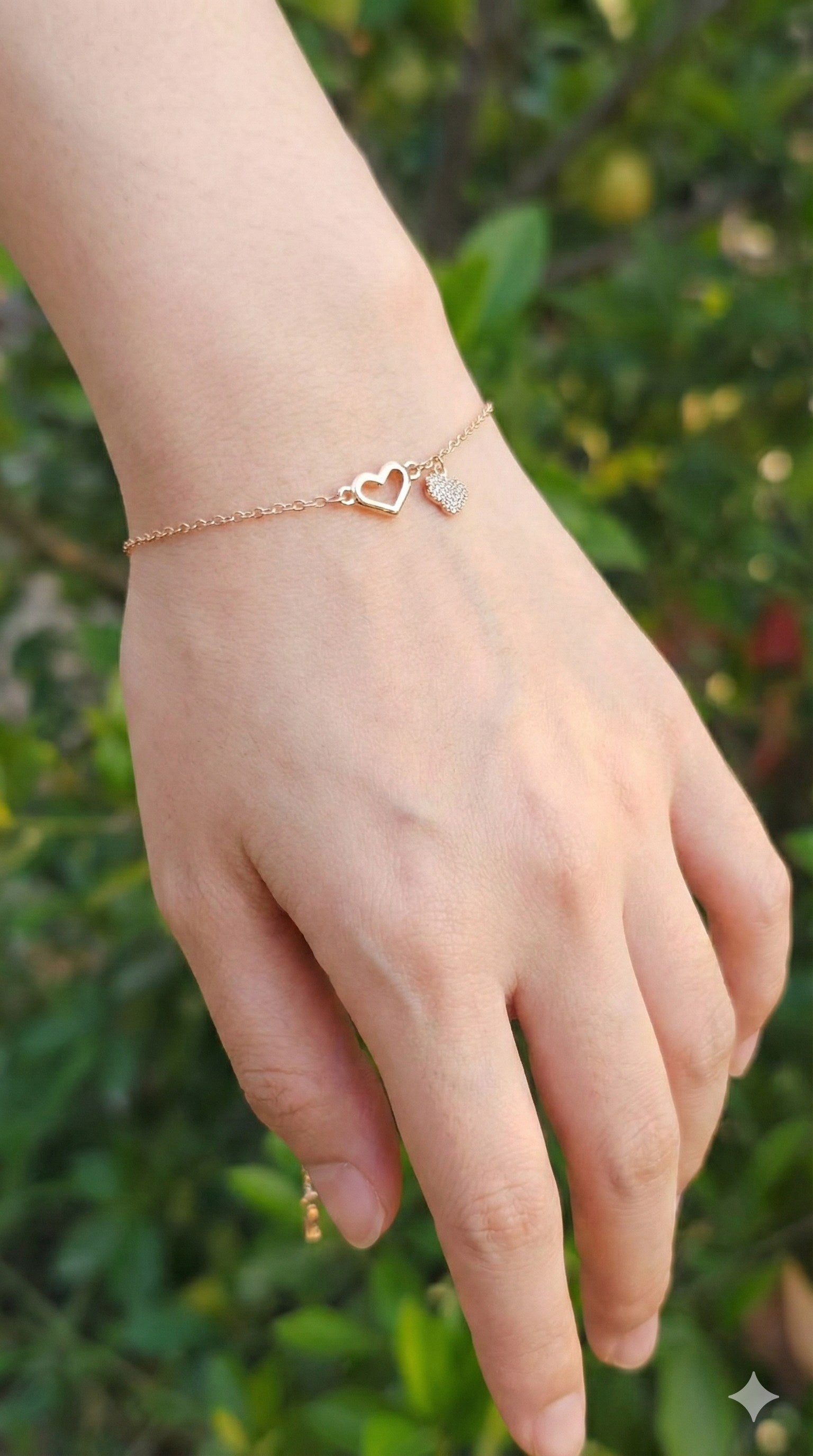 young woman wearing gold-plated hypoallergenic bracelet, showing their anti-tarnish shine suitable for sensitive skin and daily wear