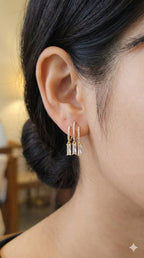 young woman wearing gold-plated hypoallergenic earrings, showing their anti-tarnish shine suitable for sensitive skin and daily wear
