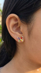 young woman wearing gold-plated hypoallergenic earrings, showing their anti-tarnish shine suitable for sensitive skin and daily wear