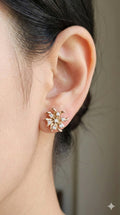 young woman wearing gold-plated hypoallergenic earrings, showing their anti-tarnish shine suitable for sensitive skin and daily wear