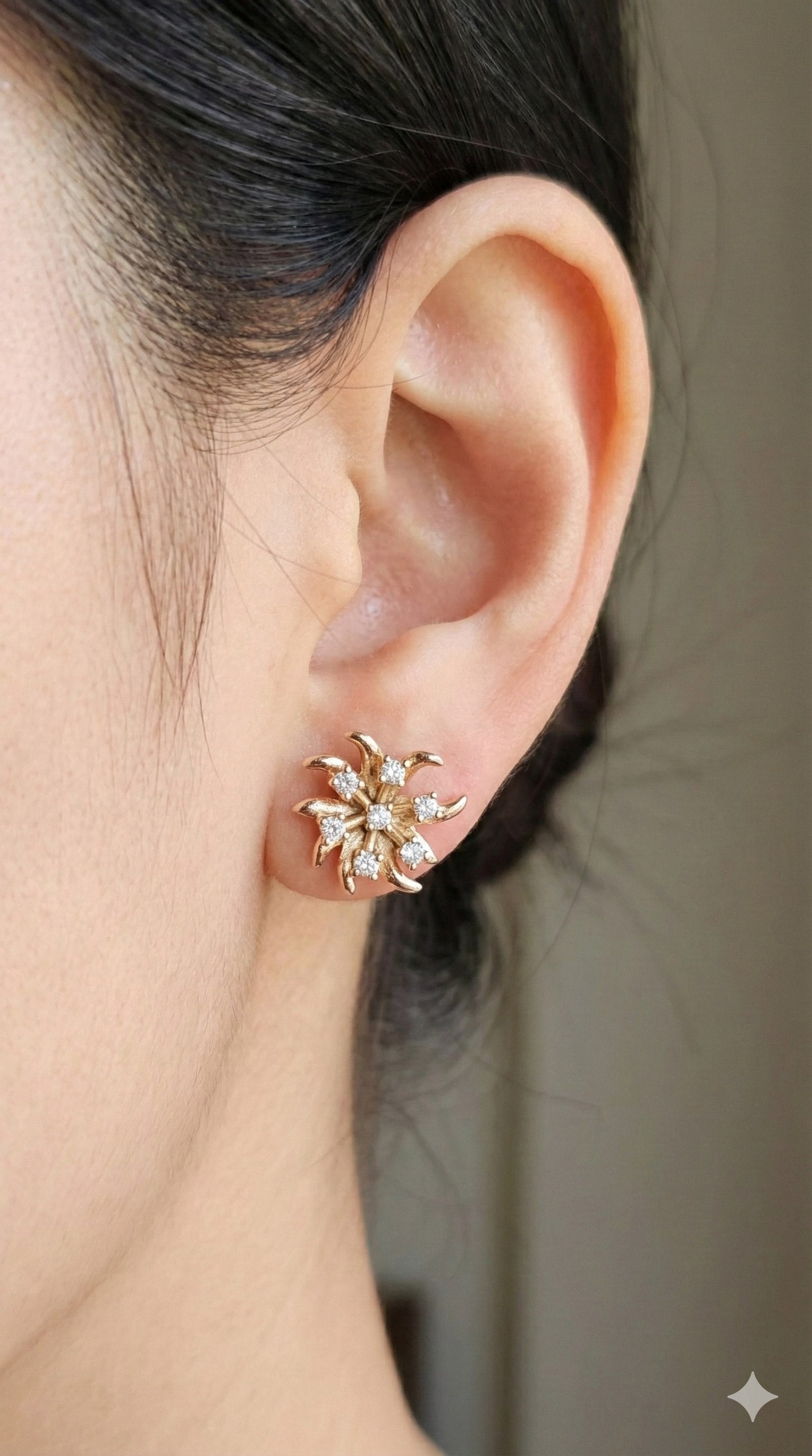 young woman wearing gold-plated hypoallergenic earrings, showing their anti-tarnish shine suitable for sensitive skin and daily wear