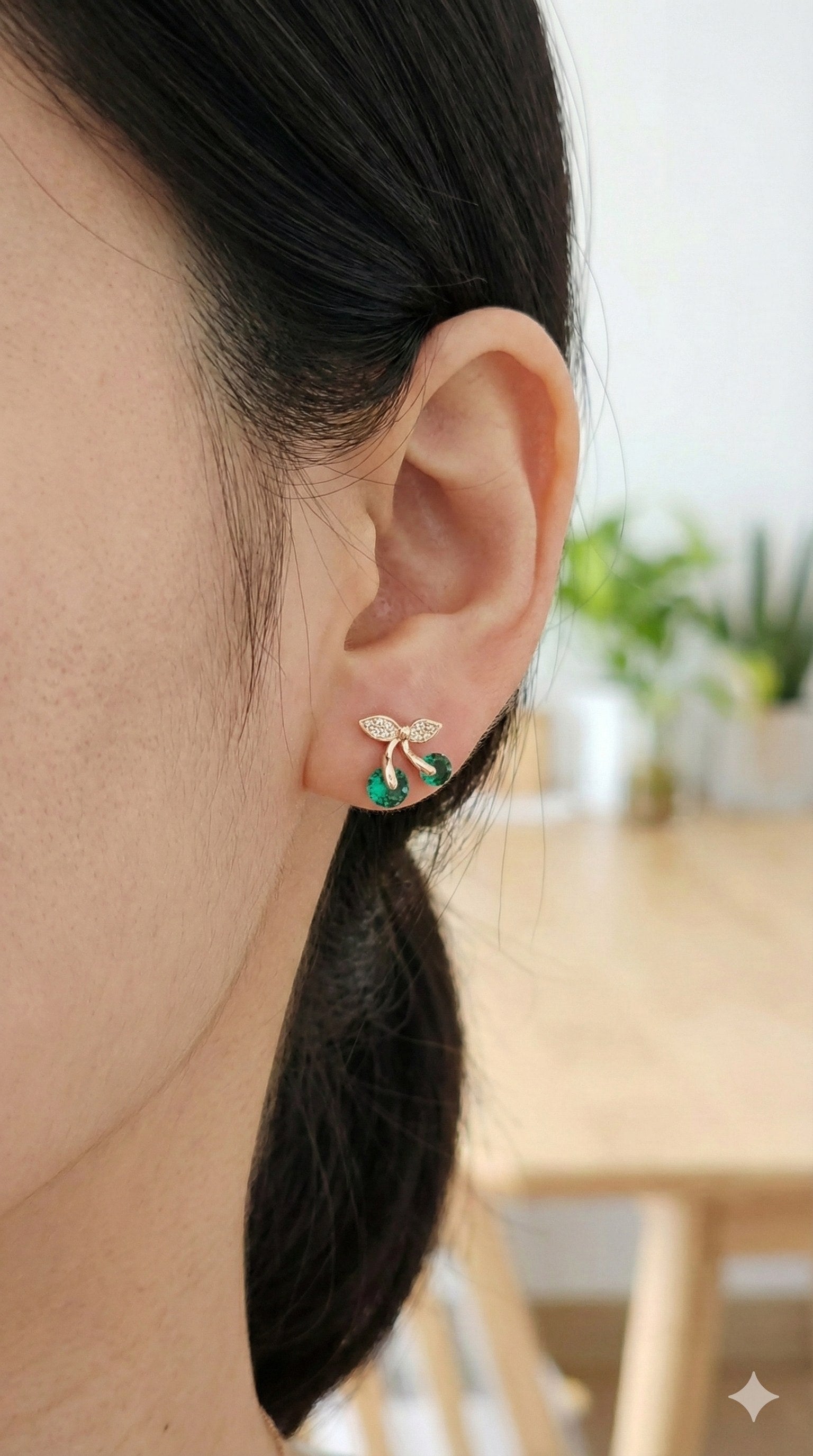 young woman wearing gold-plated hypoallergenic earrings, showing their anti-tarnish shine suitable for sensitive skin and daily wear