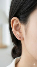 young woman wearing gold-plated hypoallergenic earrings, showing their anti-tarnish shine suitable for sensitive skin and daily wear