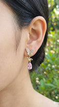 young woman wearing gold-plated hypoallergenic earrings, showing their anti-tarnish shine suitable for sensitive skin and daily wear