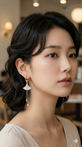 young woman wearing gold-plated hypoallergenic earrings, showing their anti-tarnish shine suitable for sensitive skin and daily wear