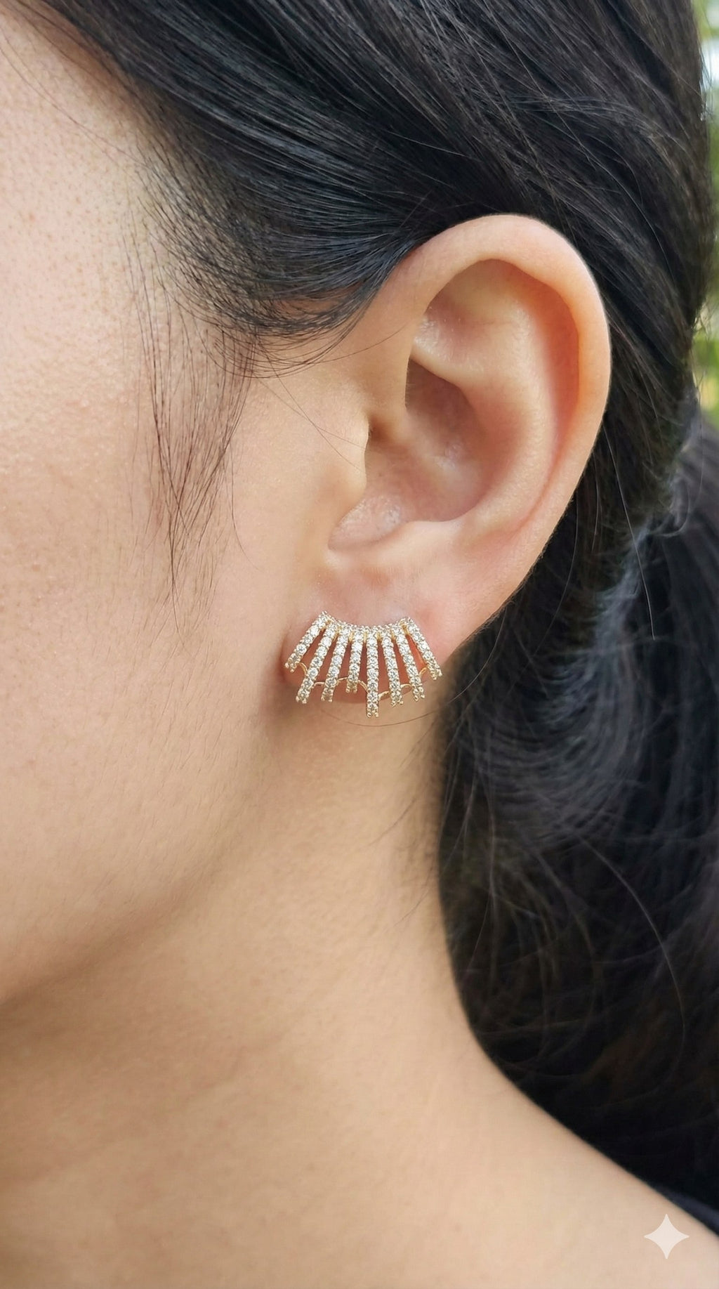 young woman wearing gold-plated hypoallergenic earrings, showing their anti-tarnish shine suitable for sensitive skin and daily wear