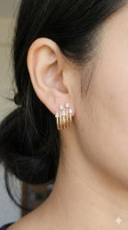 young woman wearing gold-plated hypoallergenic earrings, showing their anti-tarnish shine suitable for sensitive skin and daily wear
