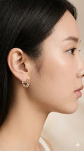 young woman wearing gold-plated hypoallergenic earrings, showing their anti-tarnish shine suitable for sensitive skin and daily wear