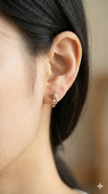 young woman wearing gold-plated hypoallergenic earrings, showing their anti-tarnish shine suitable for sensitive skin and daily wear