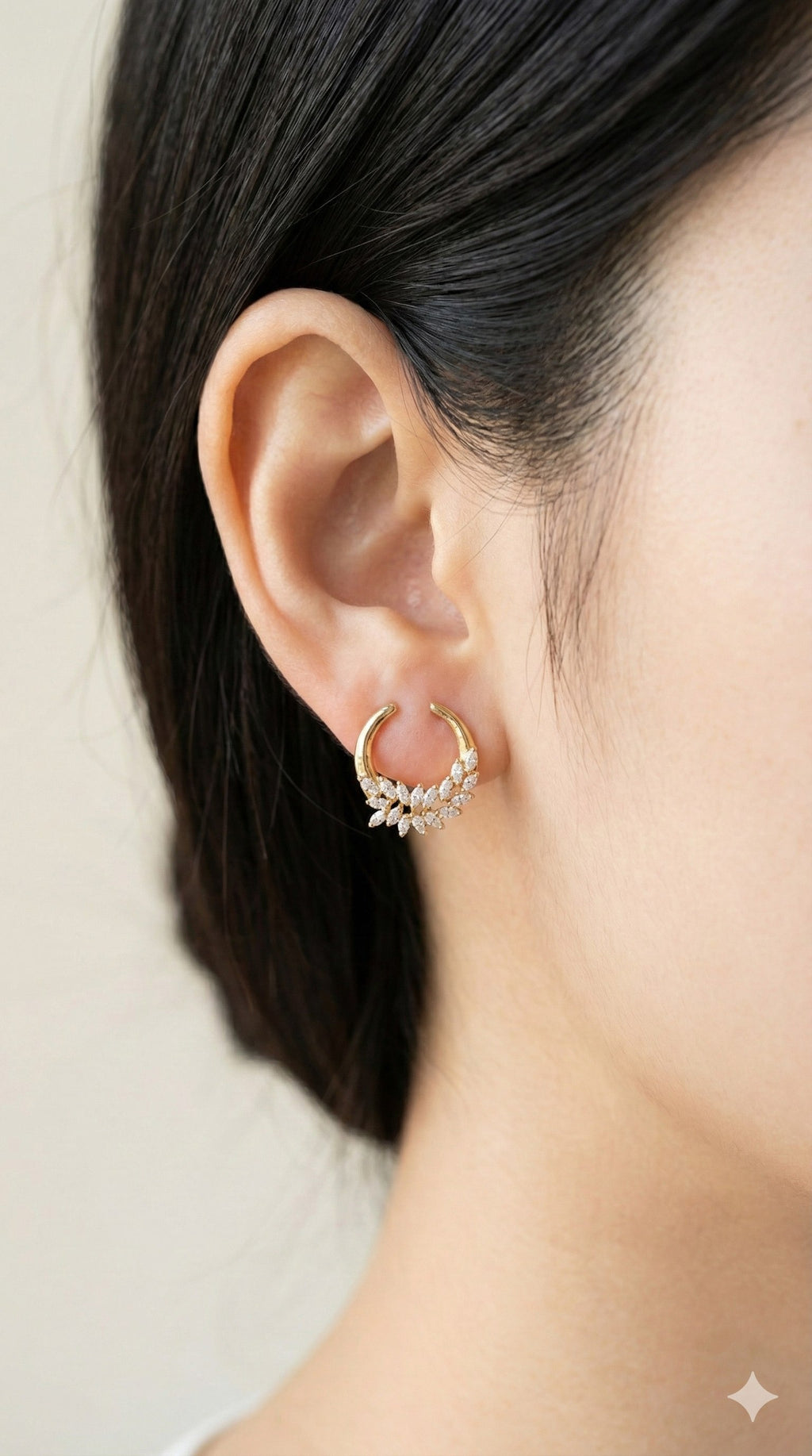 young woman wearing gold-plated hypoallergenic earrings, showing their anti-tarnish shine suitable for sensitive skin and daily wear
