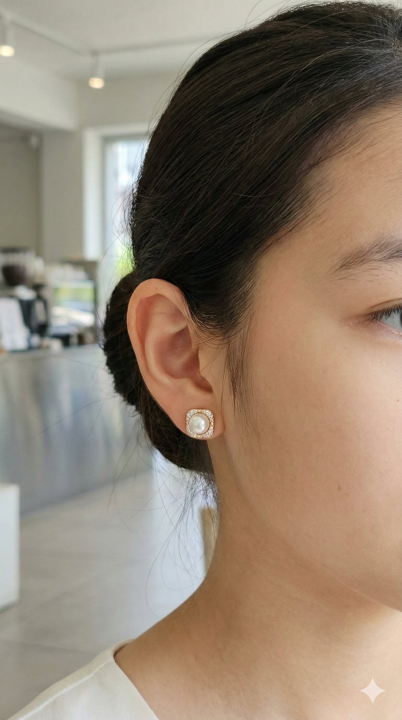 young woman wearing gold-plated hypoallergenic earrings, showing their anti-tarnish shine suitable for sensitive skin and daily wear