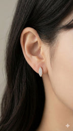 young woman wearing gold-plated hypoallergenic earrings, showing their anti-tarnish shine suitable for sensitive skin and daily wear
