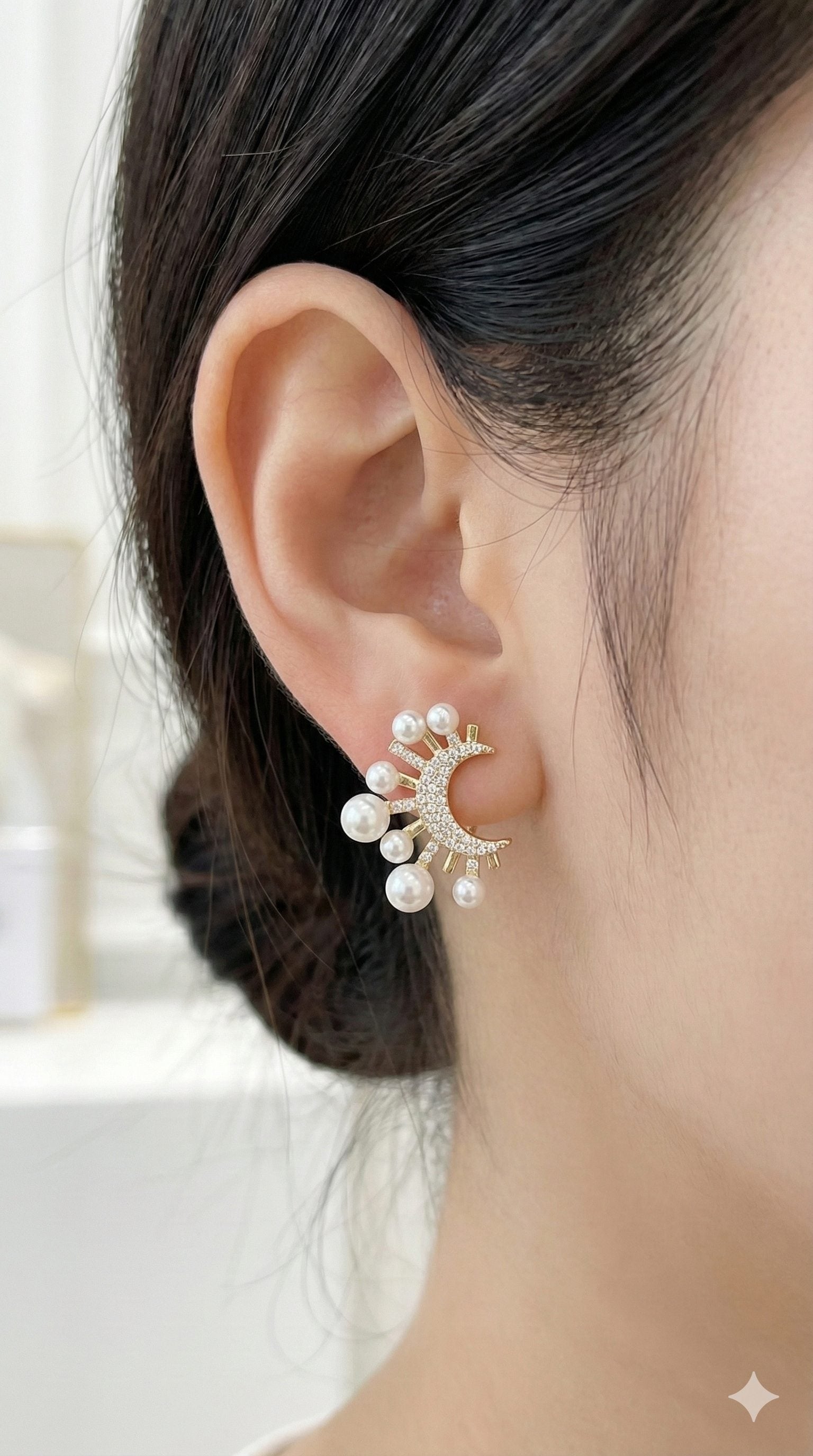 young woman wearing gold-plated hypoallergenic earrings, showing their anti-tarnish shine suitable for sensitive skin and daily wear