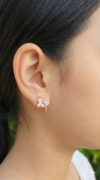 young woman wearing gold-plated hypoallergenic earrings, showing their anti-tarnish shine suitable for sensitive skin and daily wear