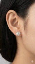 young woman wearing gold-plated hypoallergenic earrings, showing their anti-tarnish shine suitable for sensitive skin and daily wear