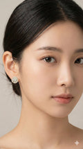 young woman wearing gold-plated hypoallergenic earrings, showing their anti-tarnish shine suitable for sensitive skin and daily wear