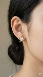 young woman wearing gold-plated hypoallergenic earrings, showing their anti-tarnish shine suitable for sensitive skin and daily wear